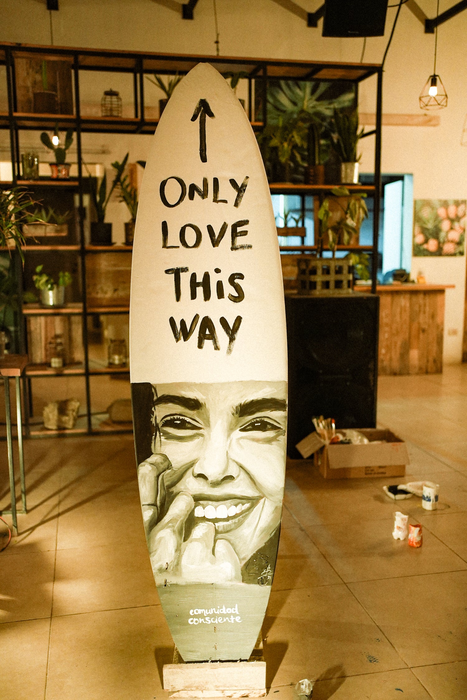 Only Love This Way painted on a surfboard